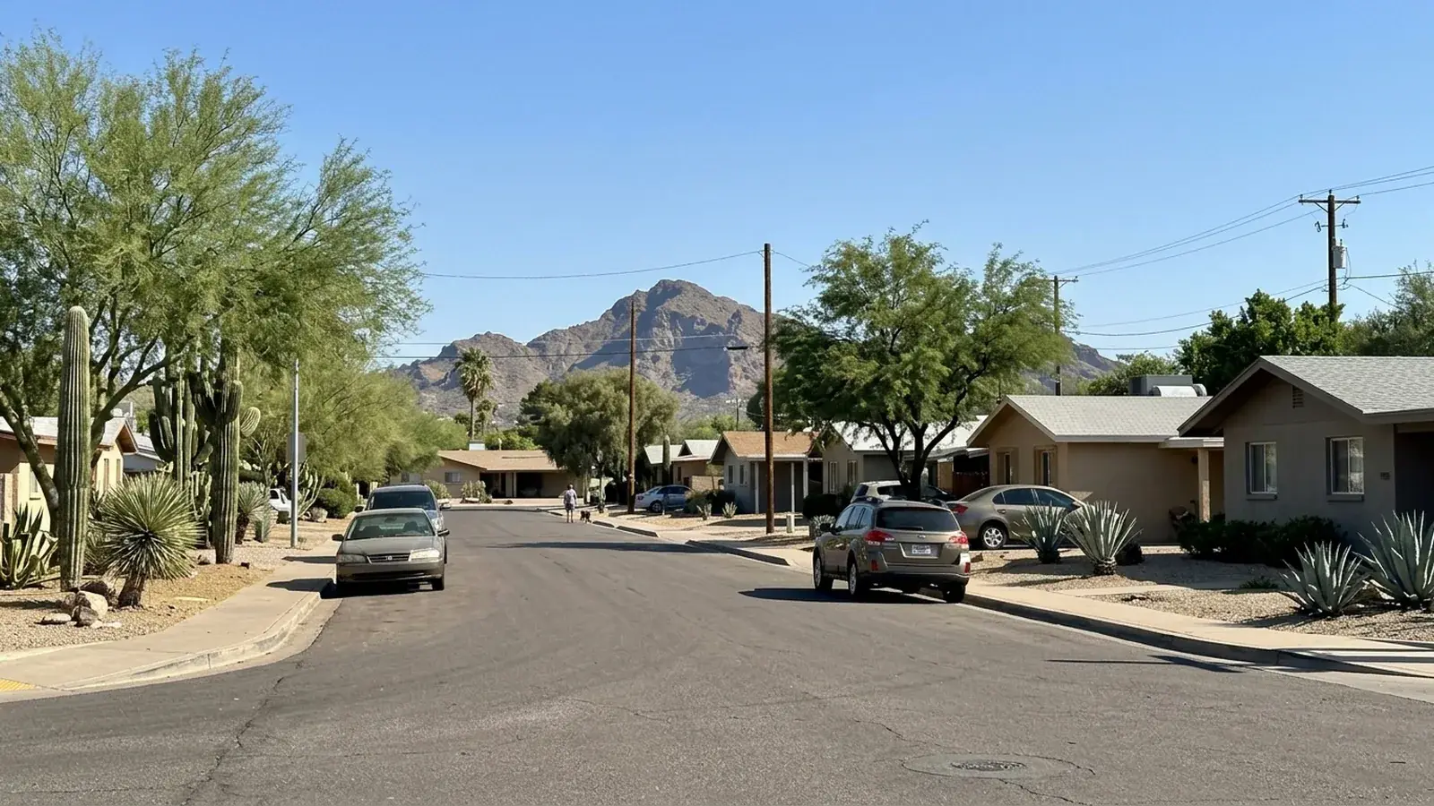 Quiet Cave Creek street with saguaros and a desert peak behind